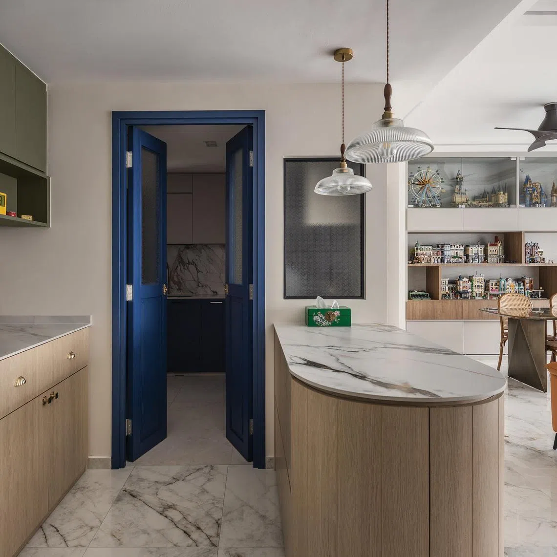 This apartment in Pasir Ris is decorated with bold blues, Lego sets and plenty of travel souvenirs.