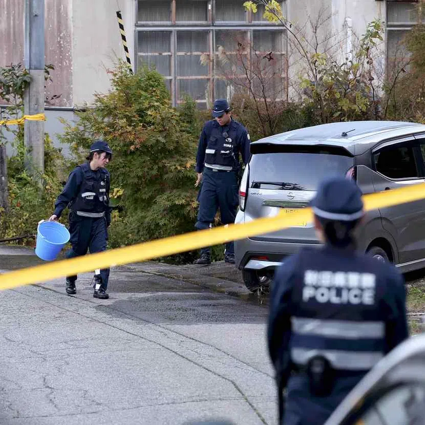 Police officers investigate near the site of a bear attack on four people in Higashi-Naruse, Akita Prefecture, on Oct 24, 2025.