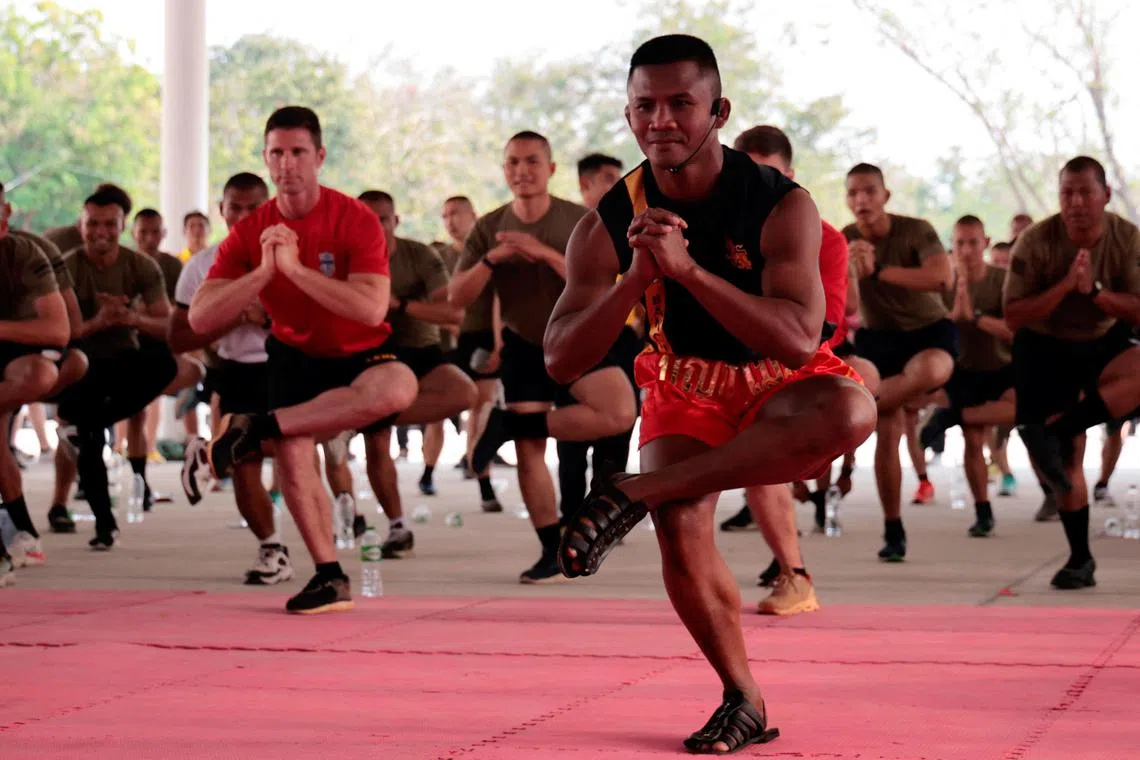 Thailand's champion Sombat Banchamek gives Muay Thai lessons to US marines as part of the "Cobra Gold 2023" (CG23) joint military exercise at Lopburi province, Thailand.