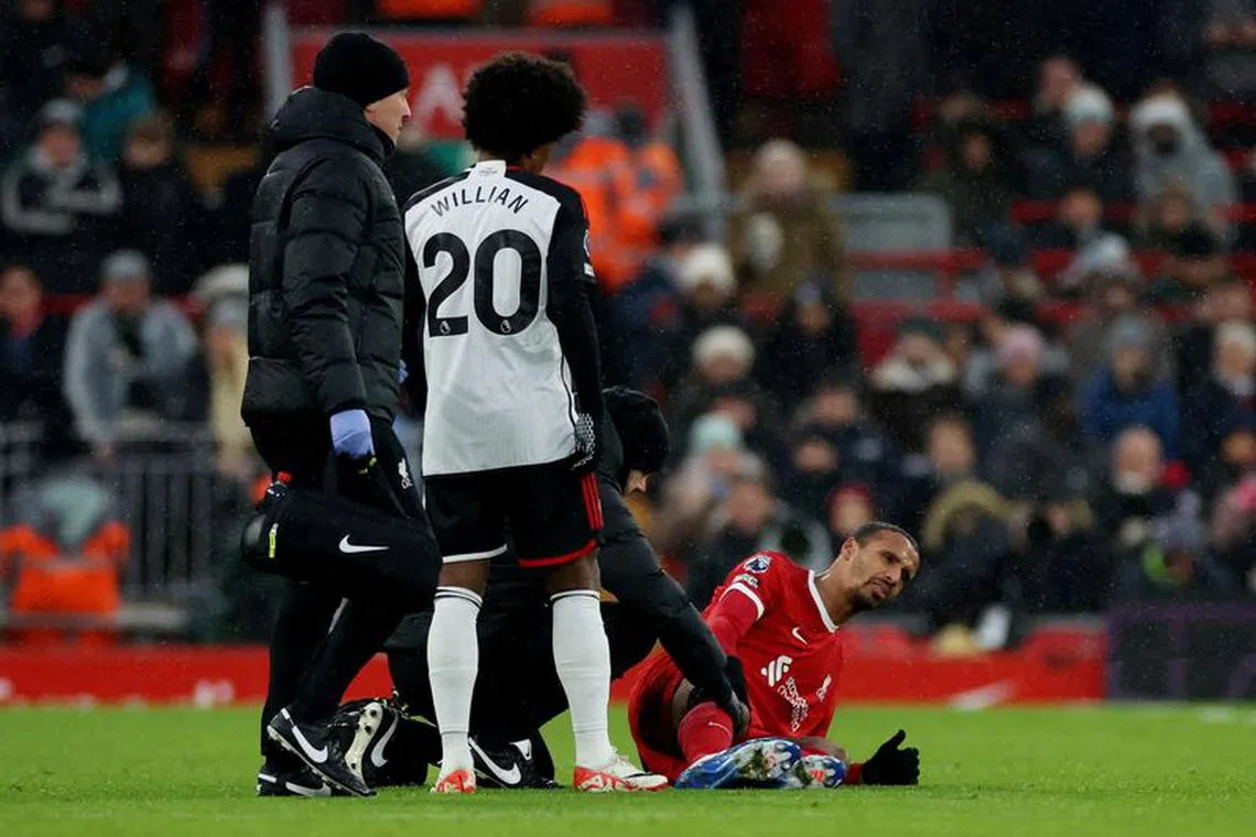 FILE PHOTO: Soccer Football - Premier League - Liverpool v Fulham - Anfield, Liverpool, Britain - December 3, 2023 Liverpool's Joel Matip receives medical attention after sustaining an injury REUTERS/Phil Noble/File Photo