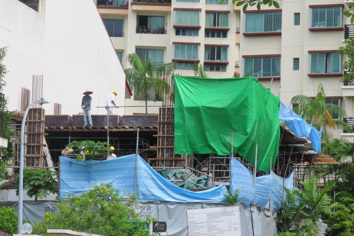 MOM inspector observed workers working at height without any fall protection. Open sides were not guarded to prevent persons from falling.