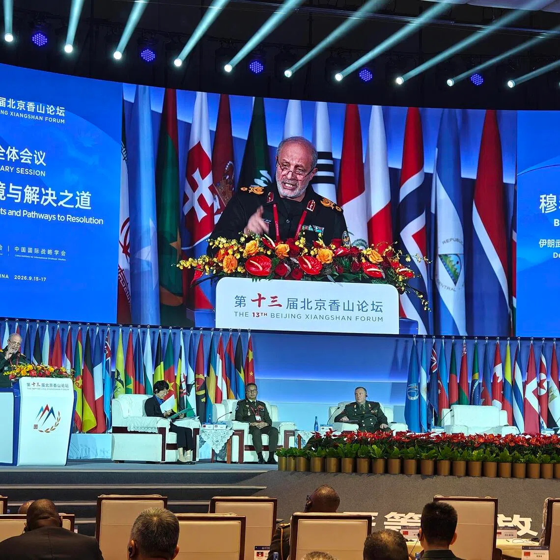 Iranian general Mohammad Taghi Osanlou (at podium) railed against the US for violating his country’s sovereignty at the Beijing Xiangshan Forum on Sept 16. Minutes ago, Saudi Prince Turki al-Faisal (far right) had accused Iran of doing the same to his country.