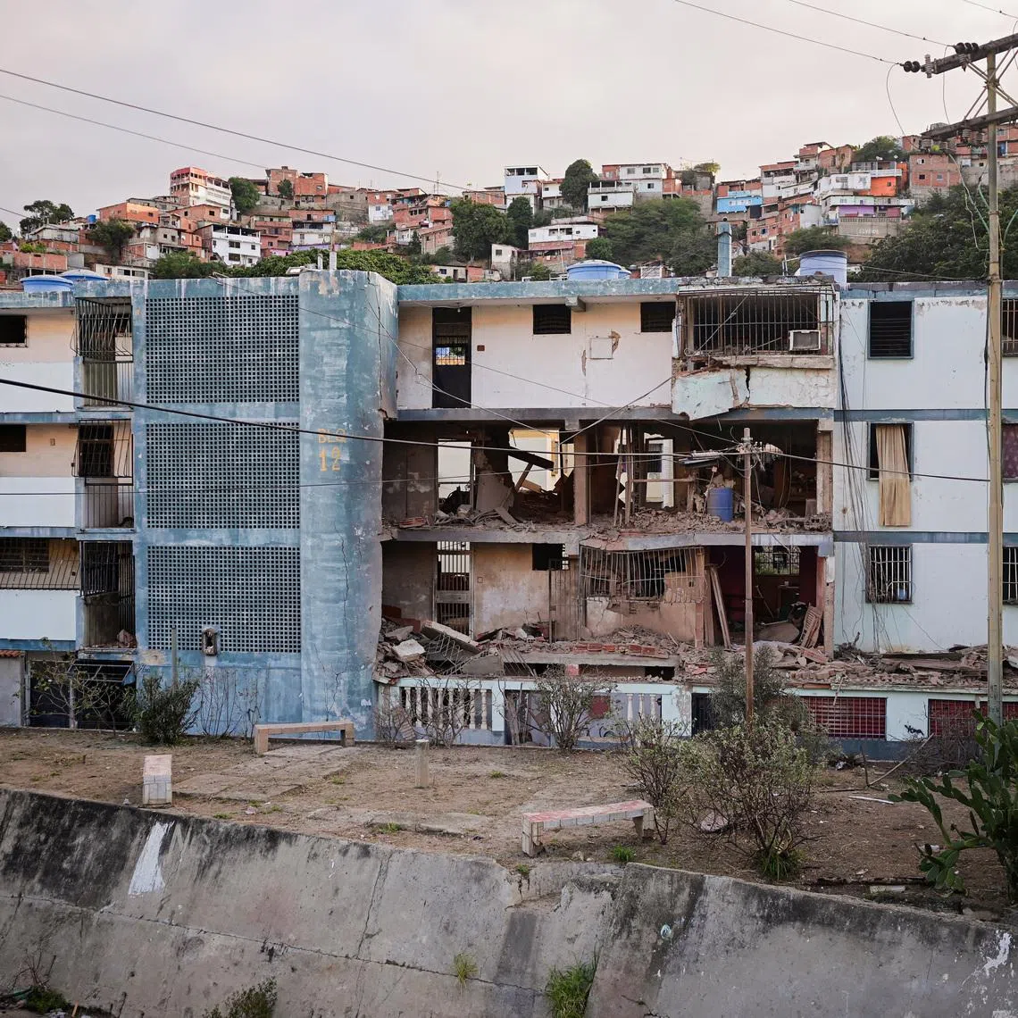 A damaged building following U.S. strikes on Venezuela, during which President Nicolas Maduro and his wife, Cilia Flores, were captured, in Catia La Mar, Venezuela, January 4, 2026. REUTERS/Gaby Oraa