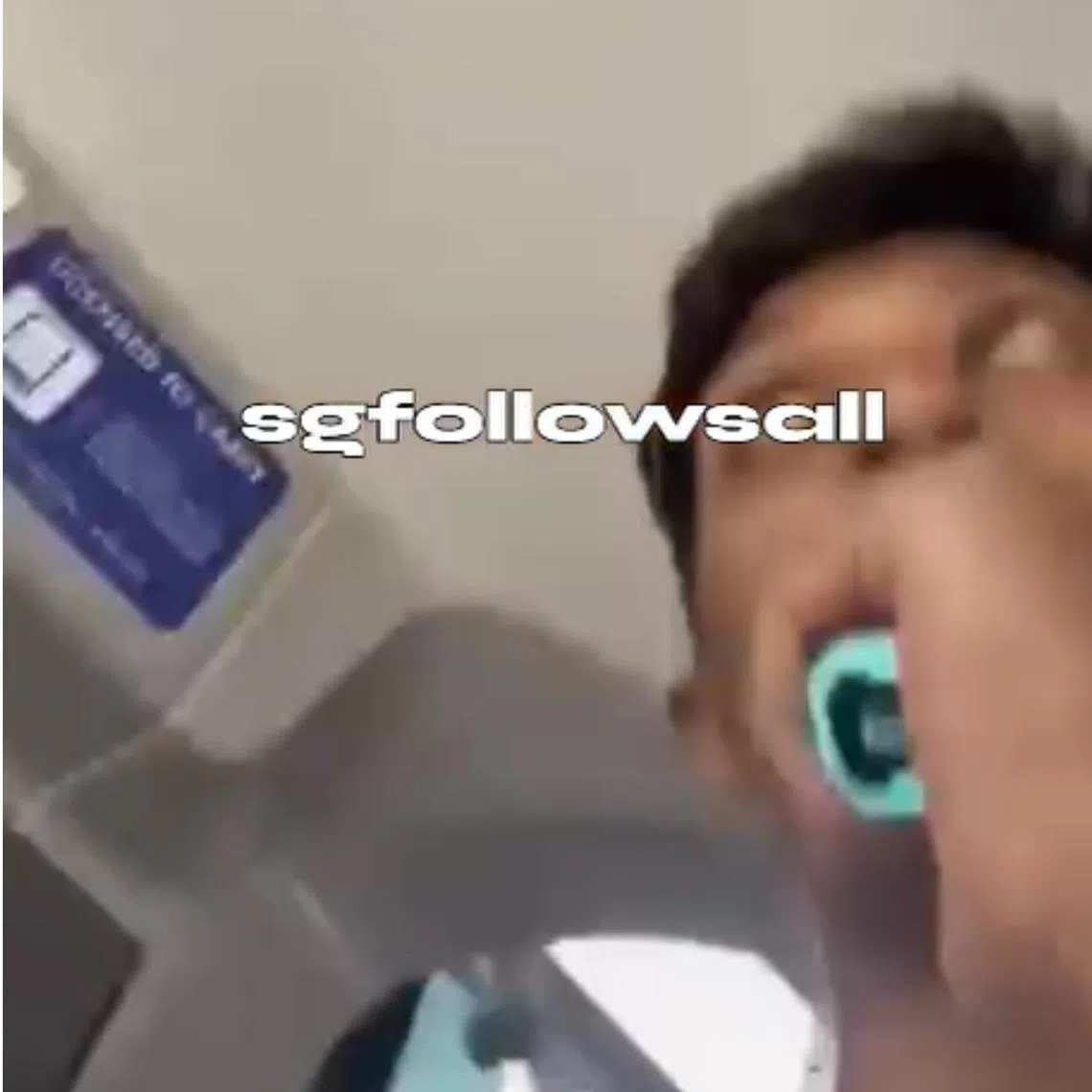 In the video, the man is seen holding what appears to be a vape up to his mouth and blowing smoke behind the bus captain.