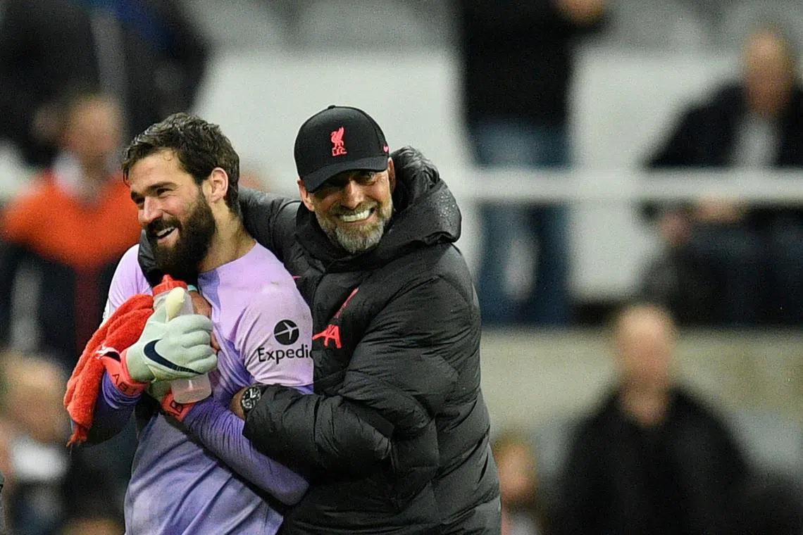 Liverpool manager Jurgen Klopp hugging goalkeeper Alisson Becker at the end of the game against Newcastle at St James' Park. 