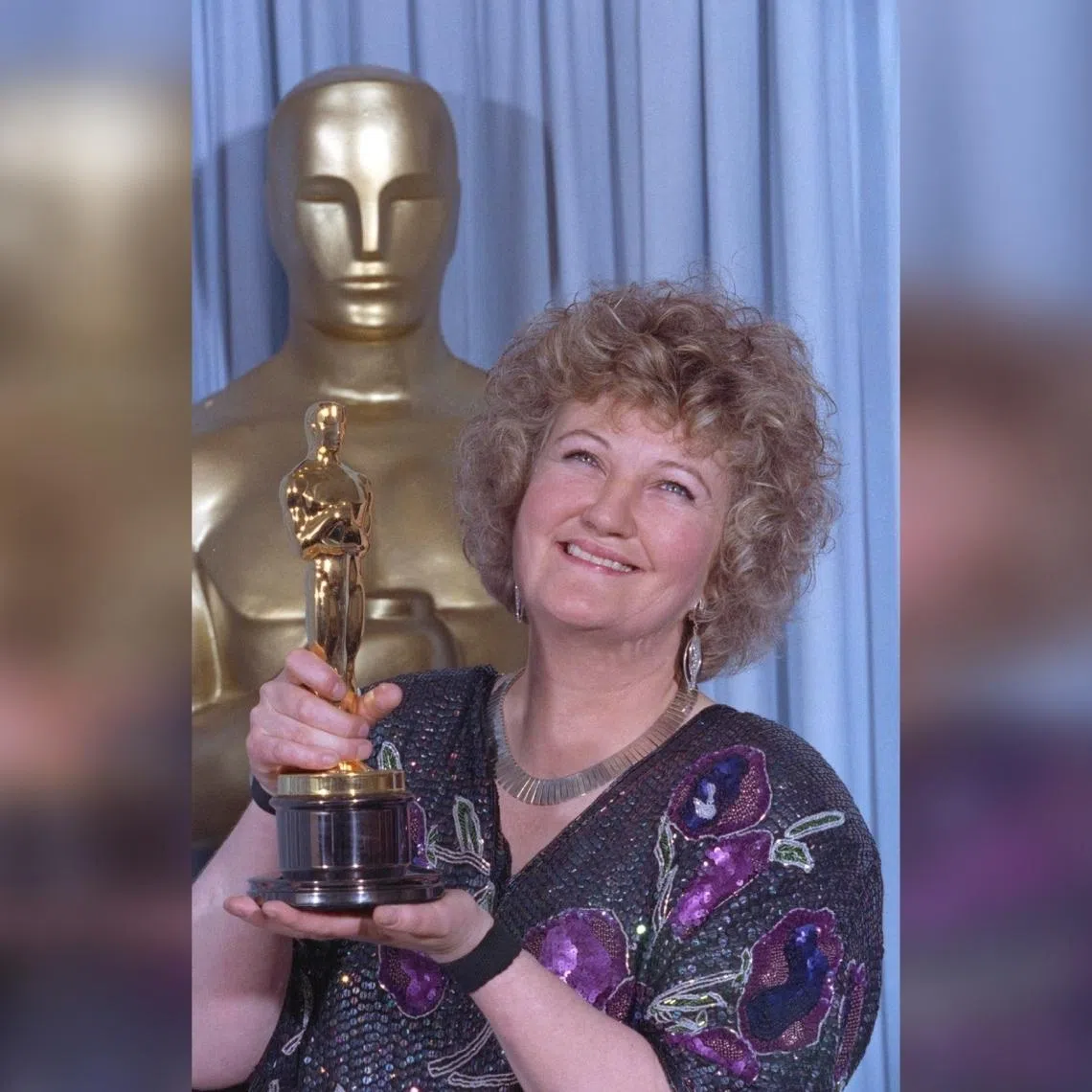 Brenda Fricker holds up her Oscar after winning the Best Supporting Actress category at Academy Awards on  March 26, 1990.