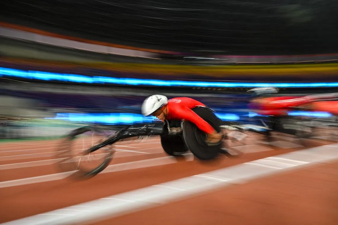 Athletes competing in the men's 5000m-T54 final at the Huanglong Sport Centre Stadium during the 2022 Asian Para Games in Hangzhou in China's eastern Zhejiang province on Oct 23, 2023. 