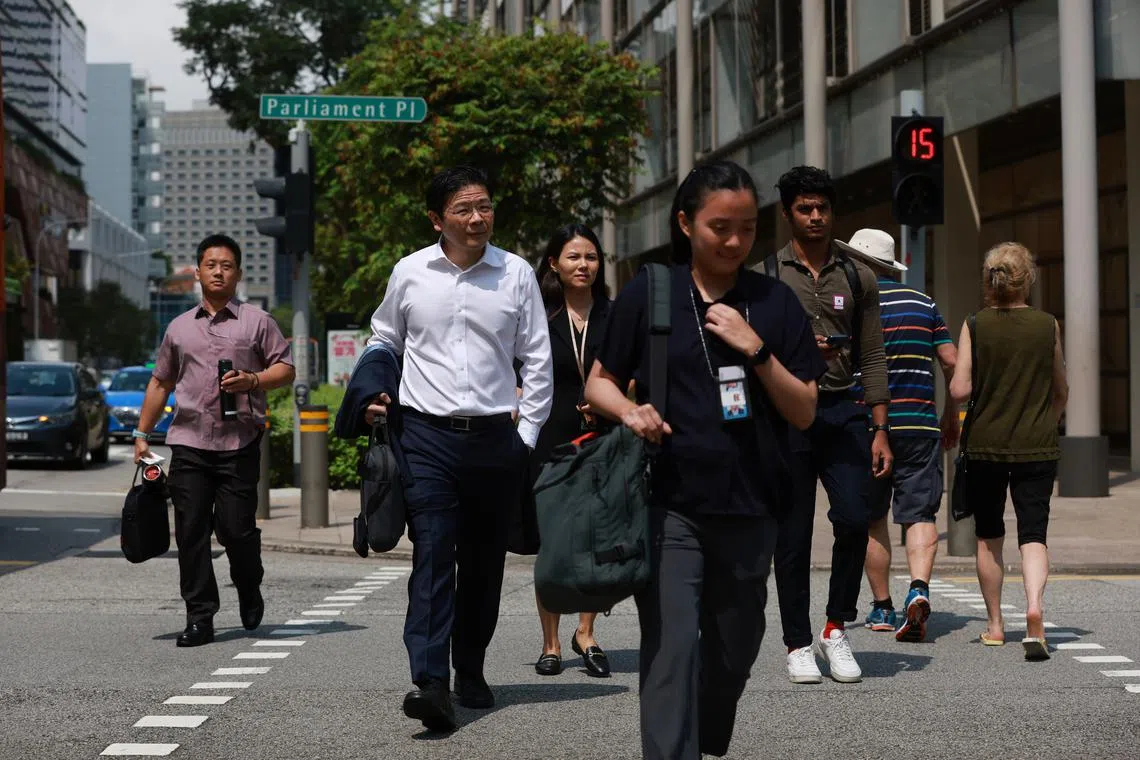 Budget - Deputy Prime Minister Lawrence Wong making his way towards Parliament House to deliver his Budget speech on Feb 14, 2023. ST Photo: Kevin Lim
