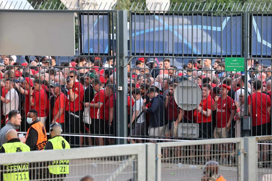 Liverpool fans unable to get through the gates at the Stade de France, where Real Madrid and the English giants were to contest the 2022 Champions League final.  