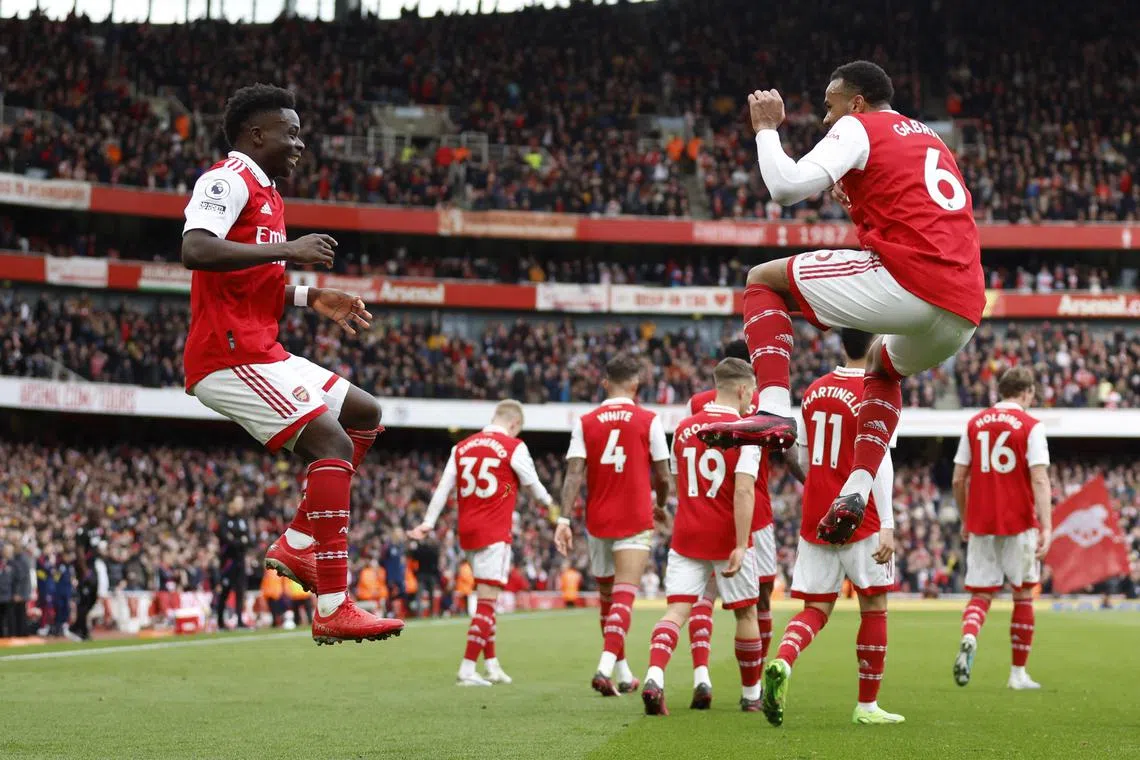 Arsenal's Bukayo Saka celebrates scoring a goal with teammate Gabriel.