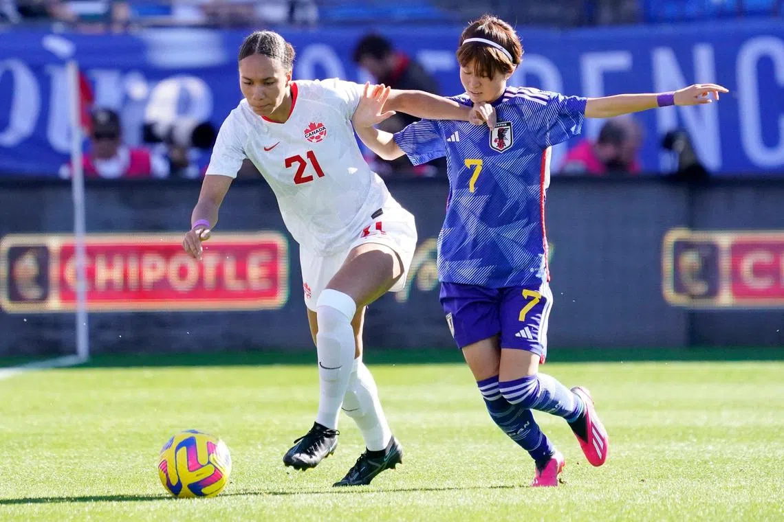 Canada's Jade Rose (No. 21) and Hinata Miyazawa tussling for the ball during the SheBelieves Cup match at Toyota Stadium in Frisco, Texas. The Canada team had threatened to boycott the tournament over pay, funding and contractual issues. 