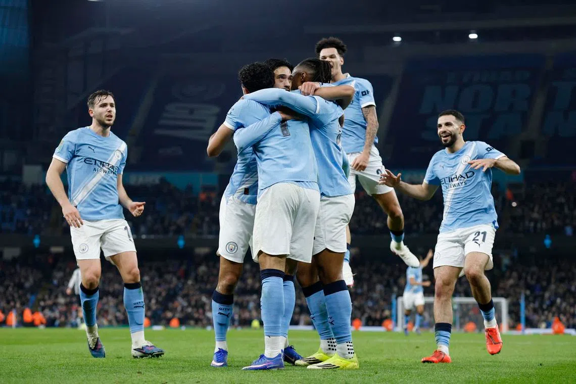 Soccer Football - Carabao Cup - Semi Final - Second Leg - Manchester City v Newcastle United - Etihad Stadium, Manchester, Britain - February 4, 2026 Manchester City's Omar Marmoush celebrates scoring their second goal with teammates Action Images via Reuters/Jason Cairnduff
