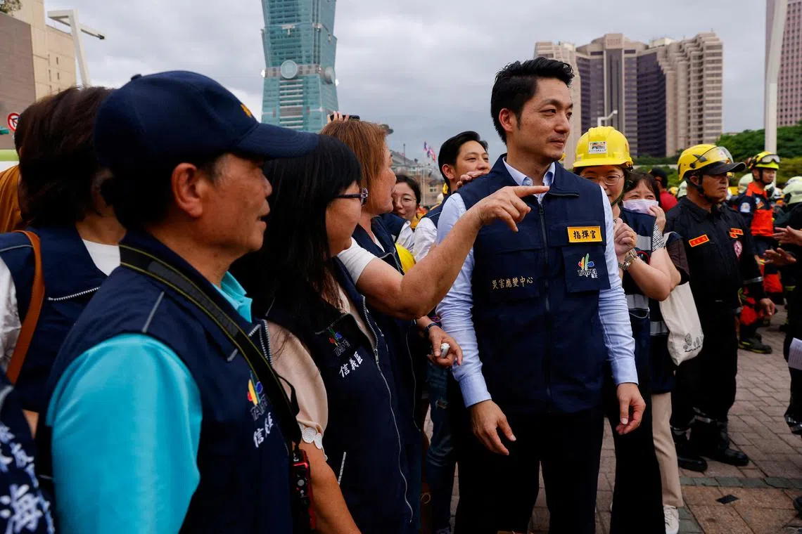 FILE PHOTO: Taipei Mayor Chiang Wan-an with his team after the annual Minan civilian defense drill, which this year focuses on the response from various agencies and volunteer groups if under attack by China in front of Taipei City hall in Taipei, Taiwan May 4, 2023. REUTERS/Ann Wang/File Photo