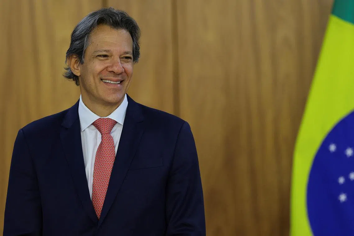 FILE PHOTO: Brazil's Finance Minister Fernando Haddad smiles during a meeting with Brazil's President Luiz Inacio Lula da Silva to announce new ApexBrasil projects, at the Planalto Palace in Brasilia, Brazil, September 17, 2024. REUTERS/Ueslei Marcelino/ File Photo