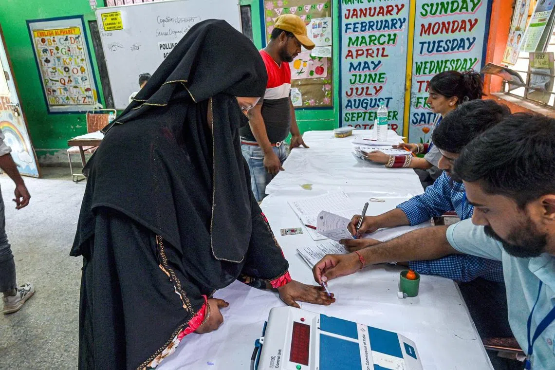 An election officer uses indelible ink to mark the finger of a voter at a polling station during the sixth phase of voting for national elections in Delhi, India, on Saturday, May 25, 2024. Indian Prime Minister Narendra Modi said his Bharatiya Janata Party has already won a majority of the seats contested in the parliamentary elections due to end next week, putting him in a position to return to office for a third term. Photographer: Prakash Singh/Bloomberg