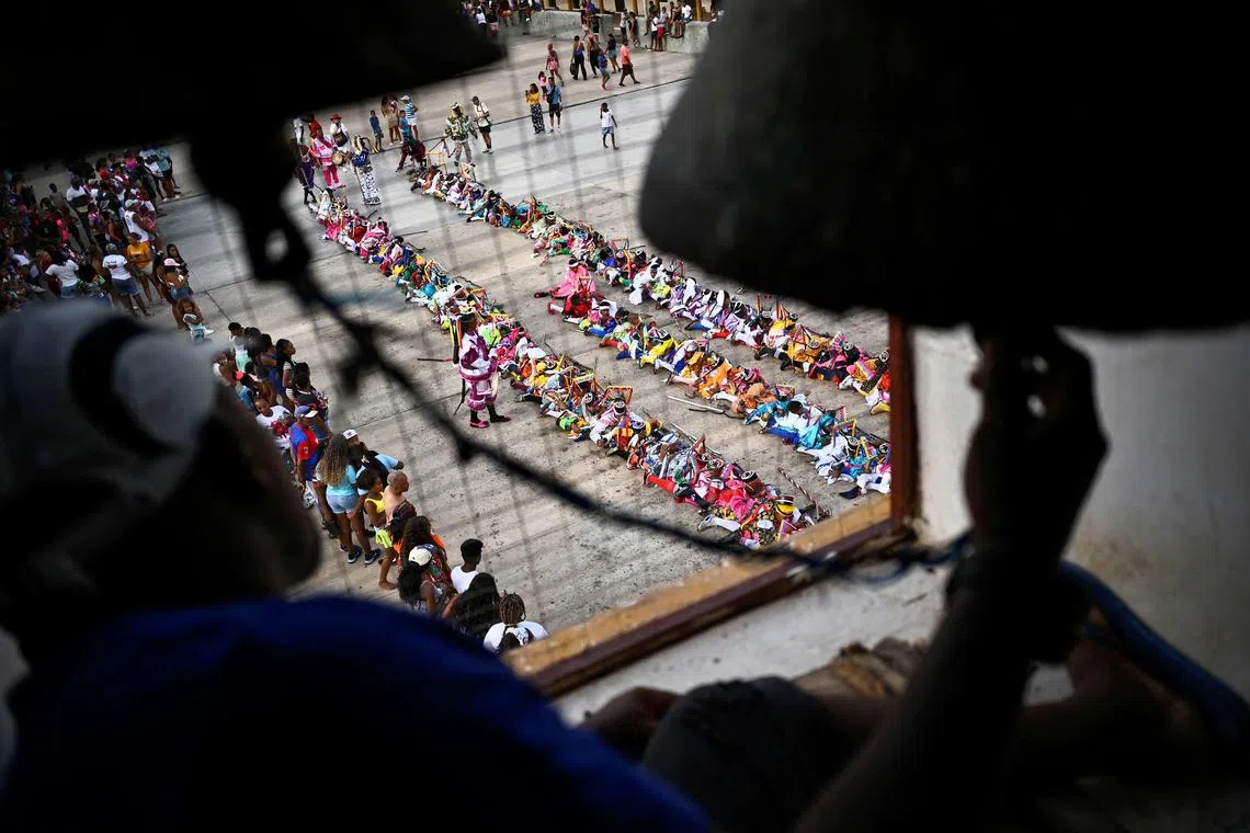 Members of the Brotherhood of the Diablos Danzantes de Chuao (Dancing Devils of Chuao) during the Corpus Christi festival in the town of Chuao, Aragua state, Venezuela, on June 18, 2025. 