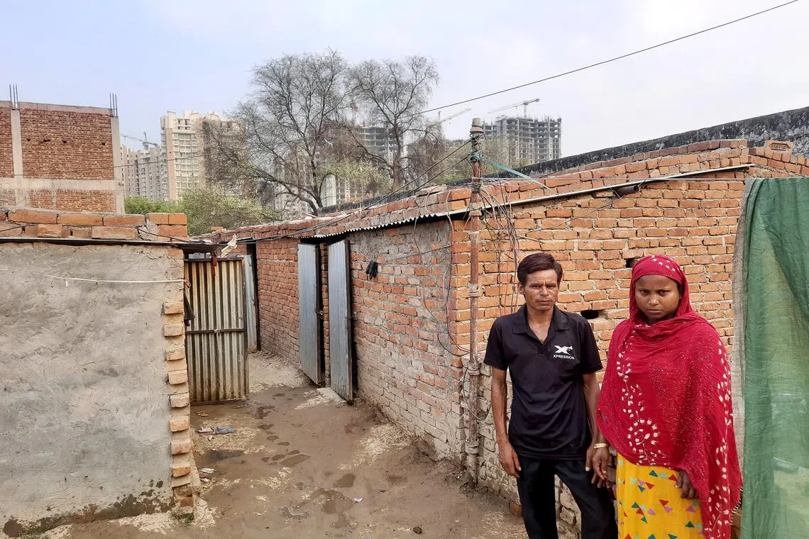  Sirajul Miya and his wife Rezina Bibi outside their one-room tenement in Noida. The daily wage construction workers did not return to their home in West Bengal to vote in the ongoing Indian general election because it was too expensive. 