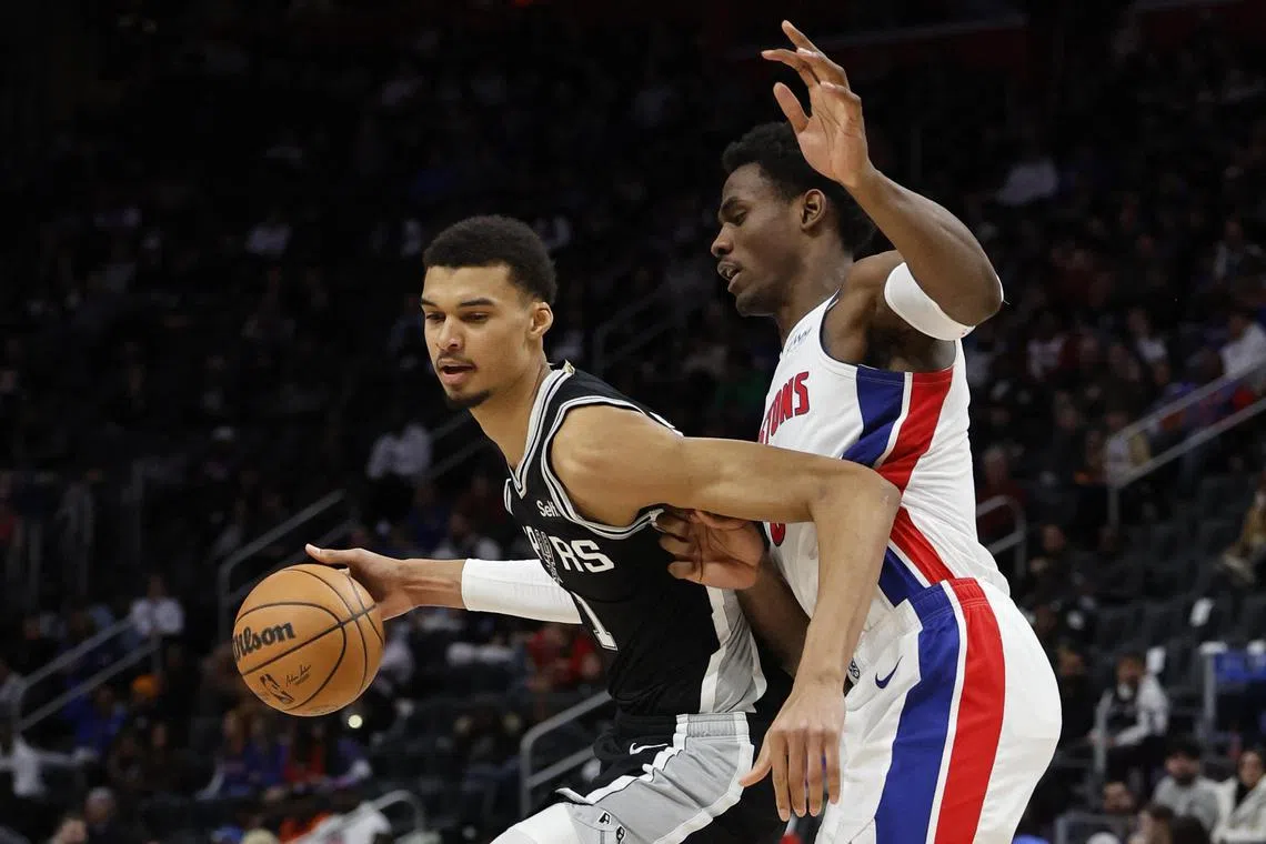 San Antonio Spurs center Victor Wembanyama (left) trying to dribble past  Detroit Pistonss Jalen Duren in the second half at Little Caesars Arena. 