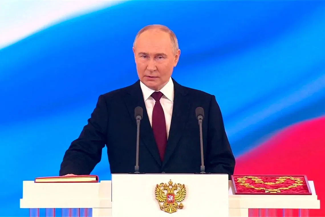 Russian President Vladimir Putin taking an oath during his inauguration at the Kremlin in Moscow on May 7.