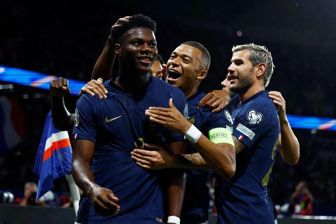 Soccer Football - Euro 2024 Qualifier - Group B - France v Republic of Ireland - Parc des Princes, Paris, France - September 7, 2023 France's Aurelien Tchouameni celebrates scoring their first goal with Kylian Mbappe and Theo Hernandez REUTERS/Sarah Meyssonnier     TPX IMAGES OF THE DAY