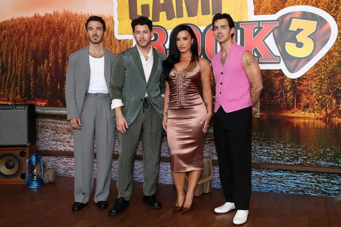(From left) Kevin Jonas, Nick Jonas, Demi Lovato and Joe Jonas at the premiere of Camp Rock 3 in Burbank, California on Aug 10.