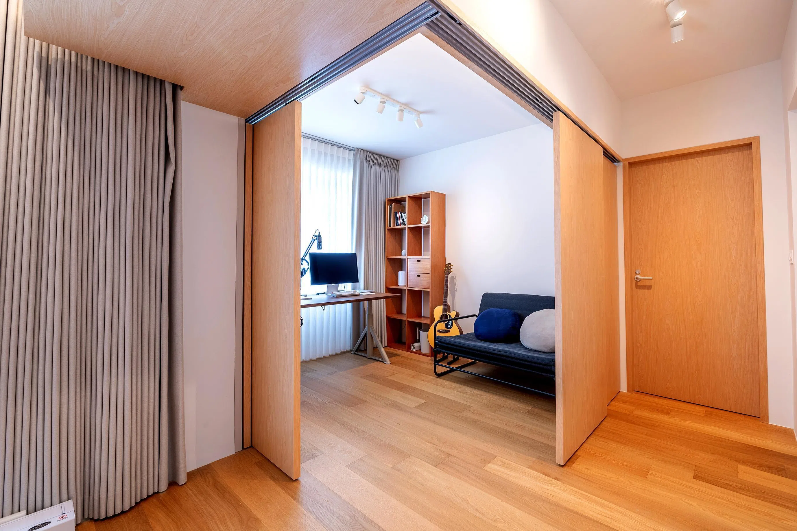 Sliding panels or doors can be used to separate living and working spaces but a downside is the lack of sound insulation.