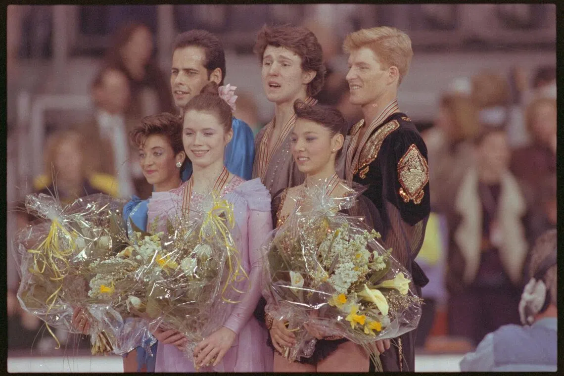 FILE PHOTO: Top three winners of the pairs world figure skating championship line up during winner ceremony l-r Canada's 2nd placer Isabelle Brasseur/Lloyd Eisler, Soviets winner Natalia Mishkutionok/Artur Dmitriev and US's Natasha Kuchiki/Todd Sand.  March 13, 1991 REUTERS/Michael Urban 91154052

CANADA CHAMPIONSHIP ICE SKATING MEDAL MUNICH US USSR WORLD FIG SKATE; Sand, Todd; Brasseur, Isabella; Dmitriev, Arthur; Eisler, Lloyd; Kuchiki, Natasha; Mishkutionok, Natalia

Todd Sand Isabella Brasseur Arthur Dmitriev Lloyd Eisler  Natasha Kuchiki Natalia Mishkutionok

DISCLAIMER: The image is presented in its original, uncropped, and untoned state. Due to the age and historical nature of the image, we recommend verifying all associated metadata, which was transferred from the index stored by the Bettmann Archives, and may be truncated./File Photo