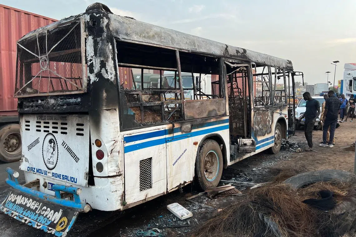Two people burned to death when attackers hurled petrol bombs into a passenger bus in Dakar..