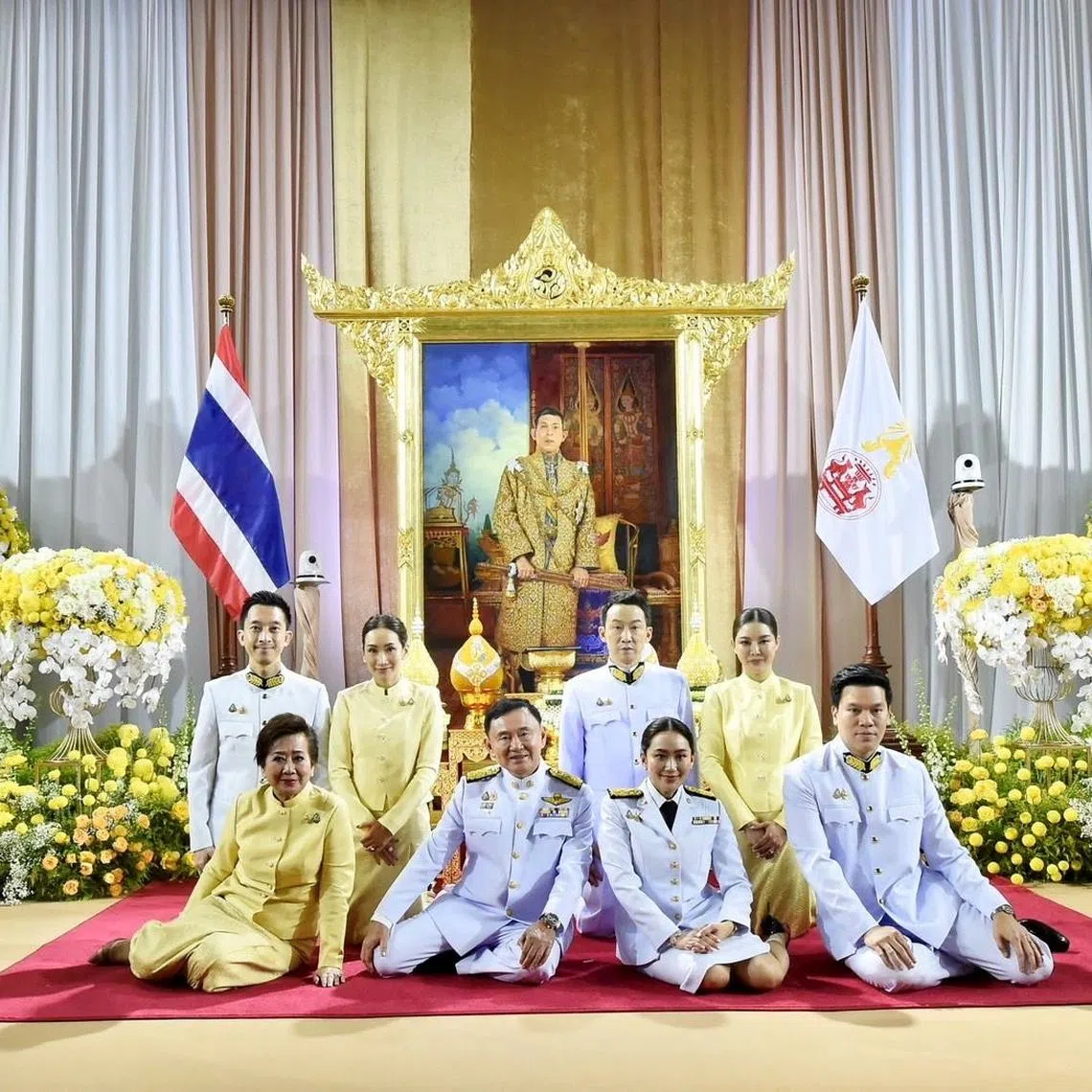 Thai PM Paetongtarn Shinawatra (seated, second from right) and her family at the Pheu Thai party's headquarters in Bangkok after a royal endorsement ceremony on Aug 18.