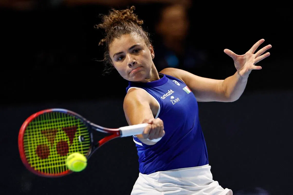 Italy's Jasmine Paolini in action during her singles match against China's Xinyu Wang.