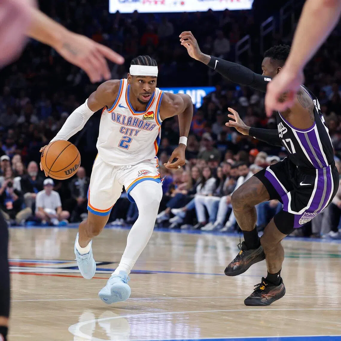 Oklahoma City Thunder guard Shai Gilgeous-Alexander driving down the court against Sacramento Kings guard Dennis Schroder during the second half of the 107-101 NBA win at Paycom Centre on Oct 28.