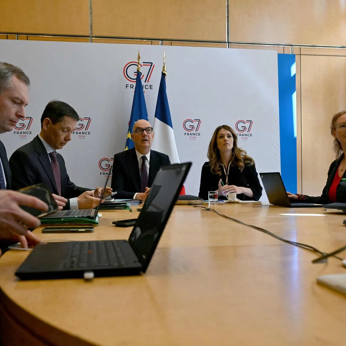 France's Economy and Finance Minister Roland Lescure and Energy Minister Maud Bregeon sit moments before hosting a video conference with the Group of Seven energy and finance ministers with central banks representatives in Paris on March 30.