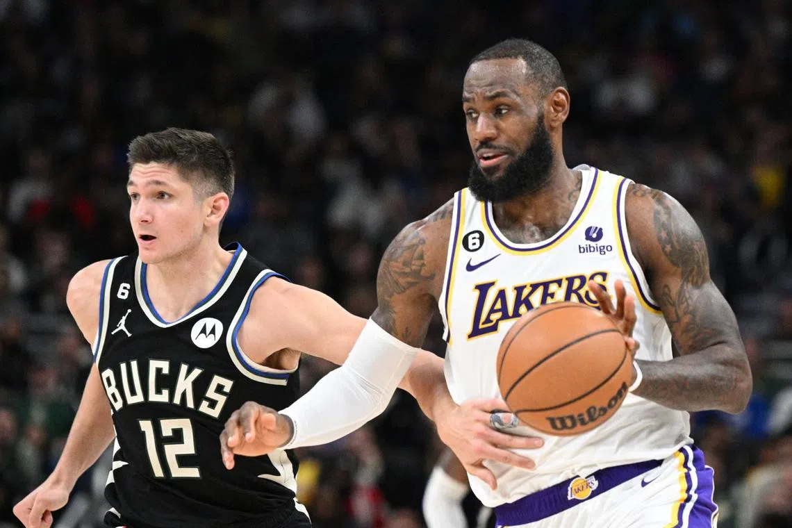 LeBron James (right) had 28 points and 11 assists in the 133-129 win over the Milwaukee Bucks.