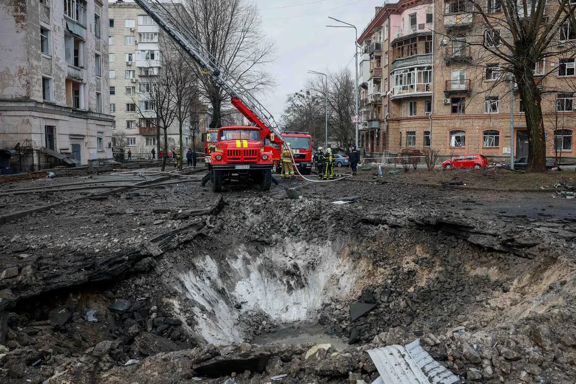 Rescuers work at a site of a building damaged during a Russian missile strike, amid Russia's attack on Ukraine, in Kyiv, Ukraine March 21, 2024. REUTERS/Alina Smutko