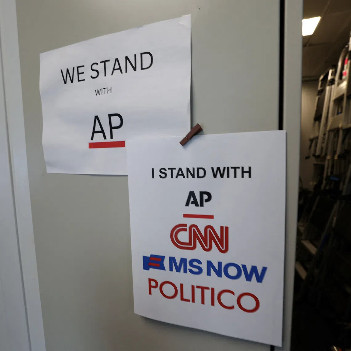 An updated solidarity sign adding CNN, MSNOW and POLITICO hangs outside the Associated Press booth at the White House grounds after US President Donald Trump banned three major news outlets – CNN, MS NOW and Politico from the White House, in Washington, D.C., US, September 21, 2026. REUTERS/Kevin Lamarque