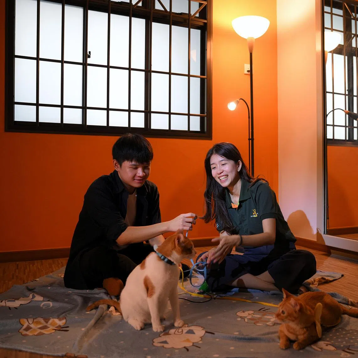 Senior Social Worker Zoe Tee (right), 34, during an animal assisted intervention session with Goay Zhen Yi, 16, on March 7, 2026.