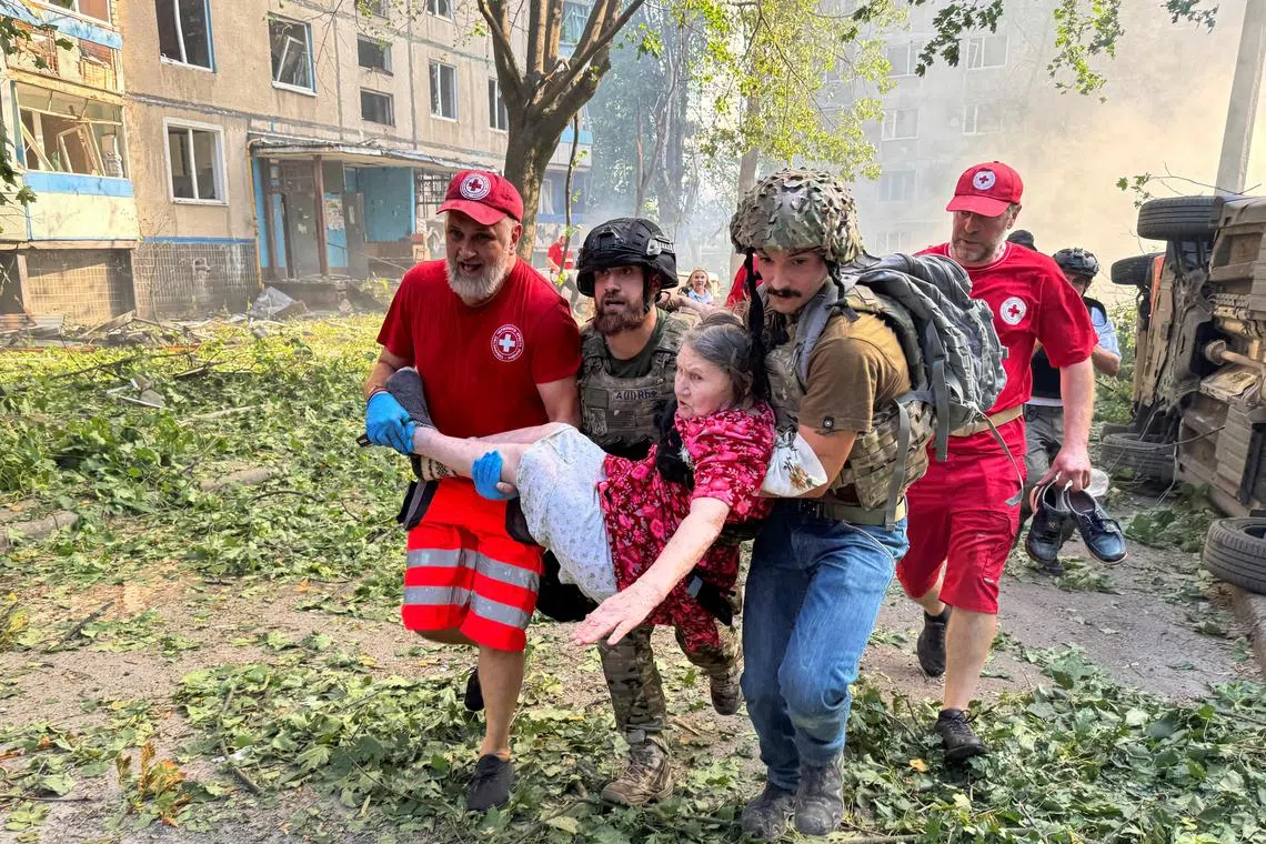 AT least 28 people were injured in Russia's guided bomb attack on a residential building in Ukraine's northeastern city of Kharkiv.