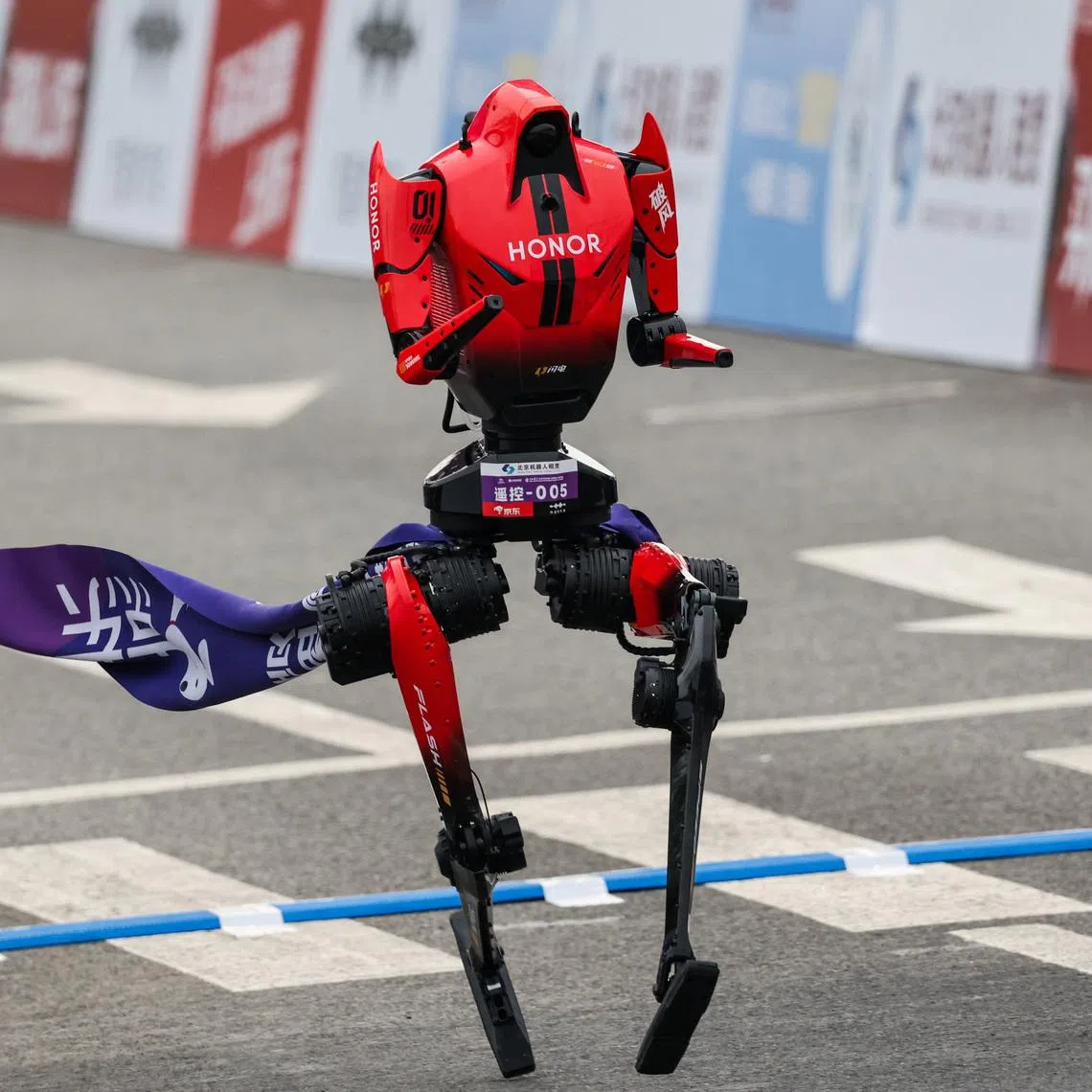 A Lightning humanoid robot by Honor crosses the finish line at the second Beijing E-Town Half Marathon and Humanoid Robot Half Marathon in Beijing on April 19.