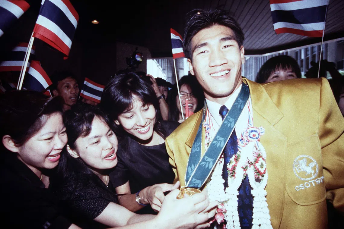 Somluck Kamsing upon his return from the 1996 Summer Olympics in Atlanta, where he won Thailand’s first gold medal in boxing.