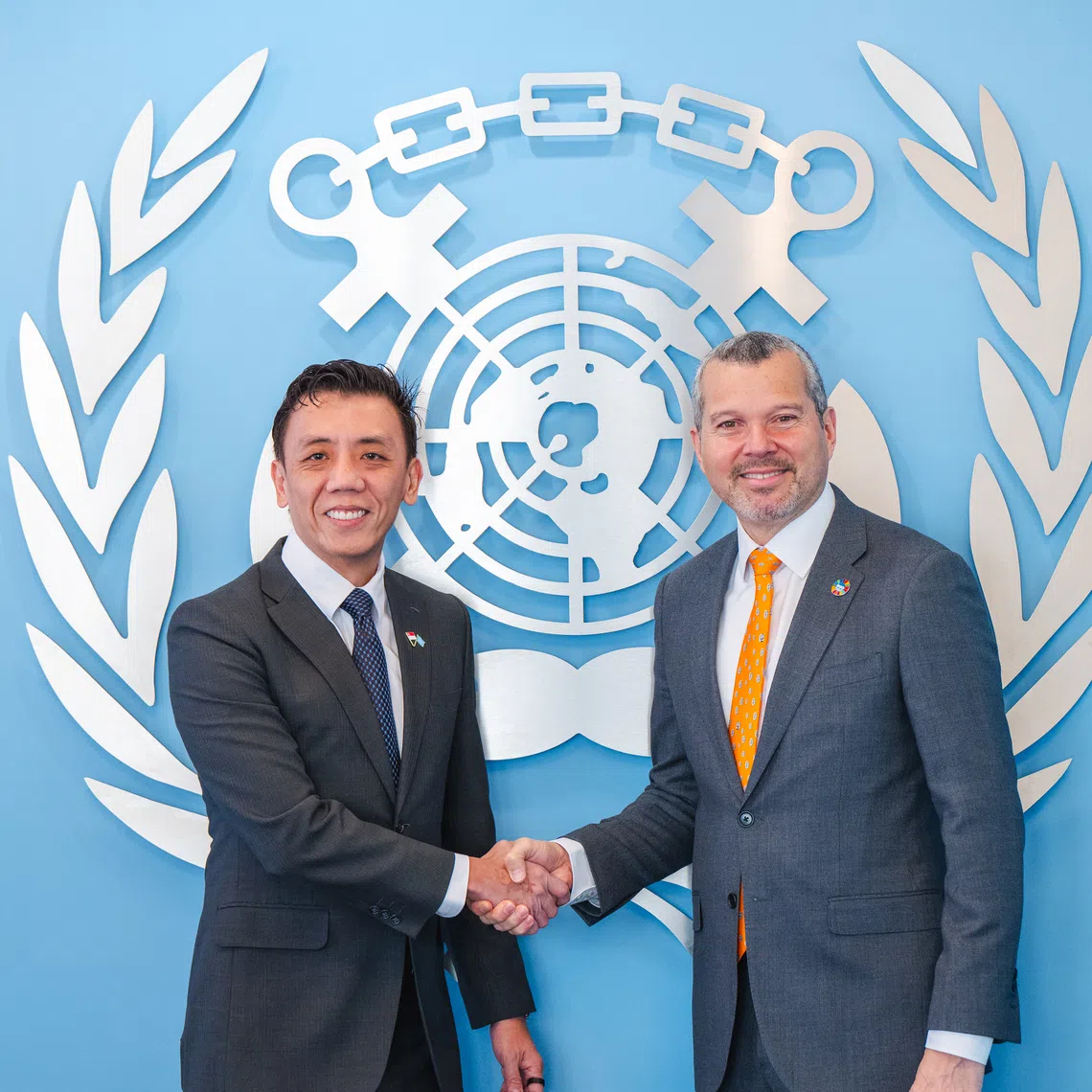 Acting Minister for Transport Jeffrey Siow (left) and International Maritime Organization secretary-general Arsenio Dominguez at the 34th Session of the International Maritime Organization Assembly.
