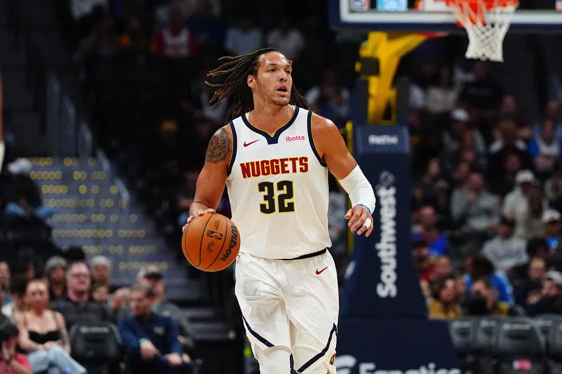 FILE PHOTO: Oct 15, 2024; Denver, Colorado, USA; Denver Nuggets forward Aaron Gordon (32) during the first quarter against the Oklahoma City Thunder at Ball Arena. Mandatory Credit: Ron Chenoy-Imagn Images/File Photo