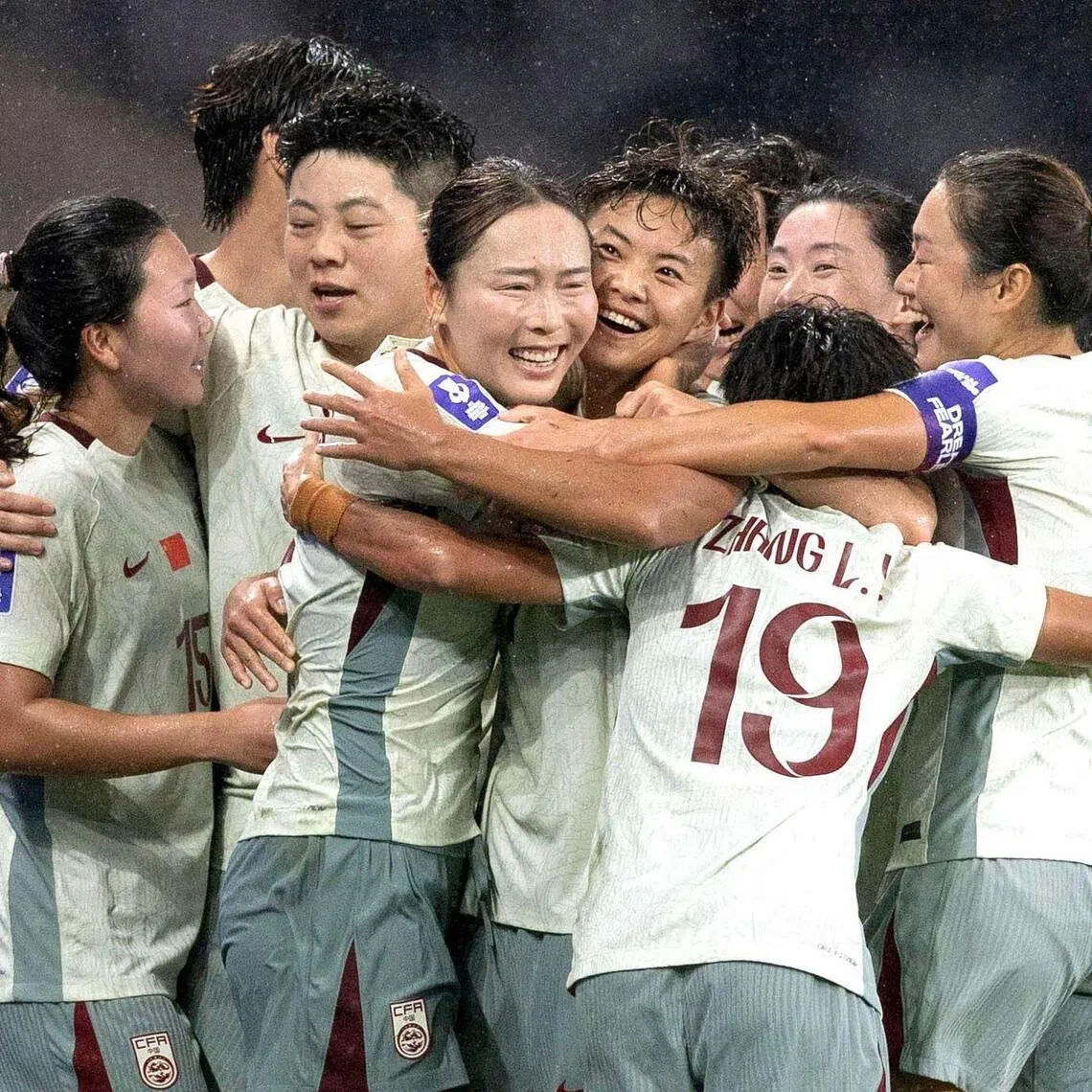 The China team celebrate after scoring a goal against North Korea in the Women's Asian Cup.
