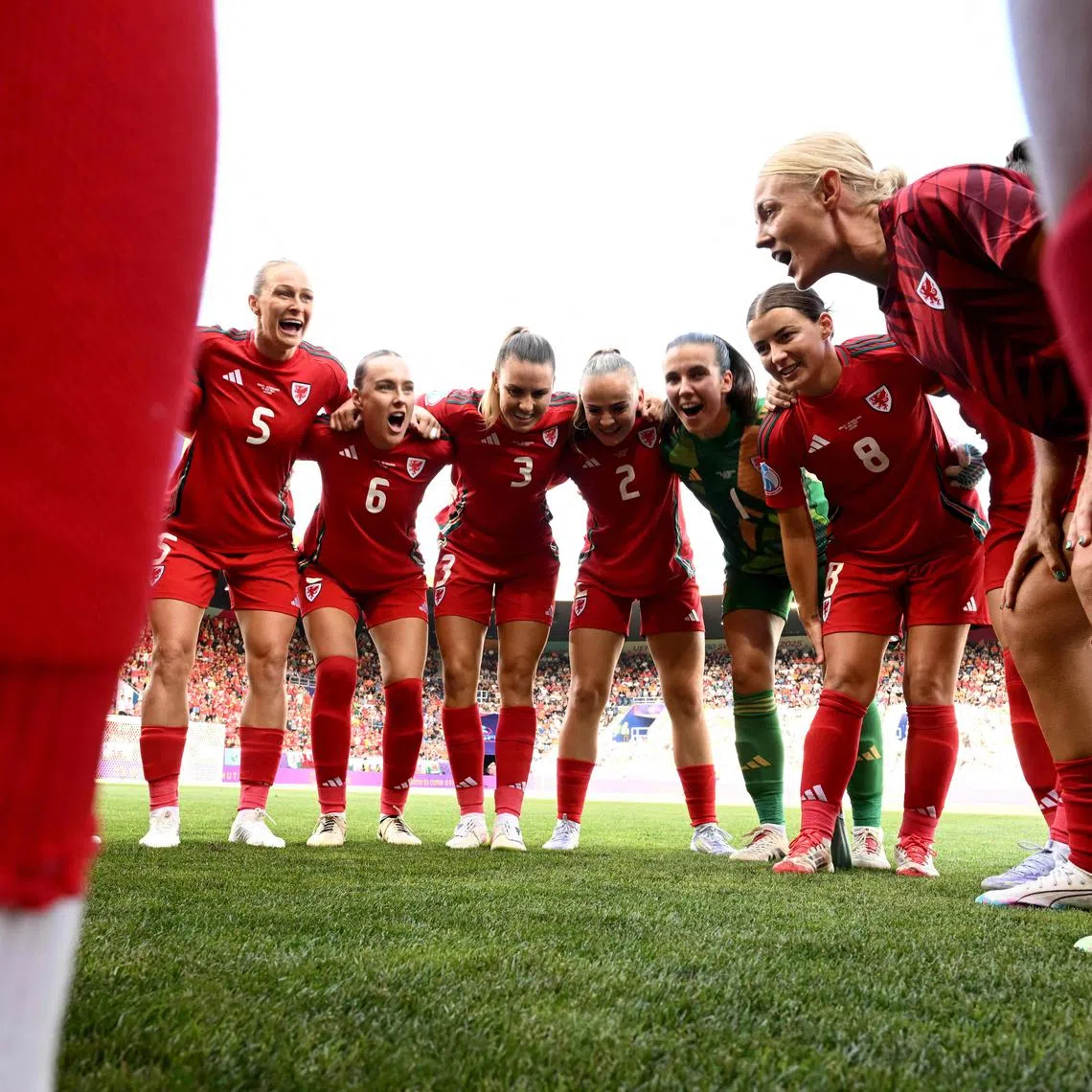 Wales players huddle ahead of the Women's Euro 2025 Group D football match against the Netherlands in Lucerne on July 5, 2025.