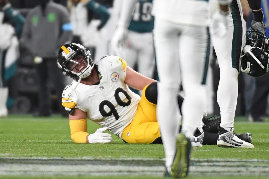 Dec 15, 2024; Philadelphia, Pennsylvania, USA; Pittsburgh Steelers linebacker T.J. Watt (90) grimaces in pain as during the fourth quarter against the Philadelphia Eagles at Lincoln Financial Field. Eric Hartline-Imagn Images/File Photo