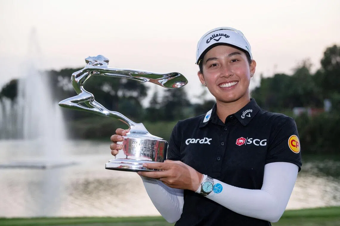 Thailand’s Jeeno Thitikul poses with the trophy after winning the Buick LPGA Shanghai golf tournament in Shanghai on October 12, 2025. (Photo by AFP) / China OUT