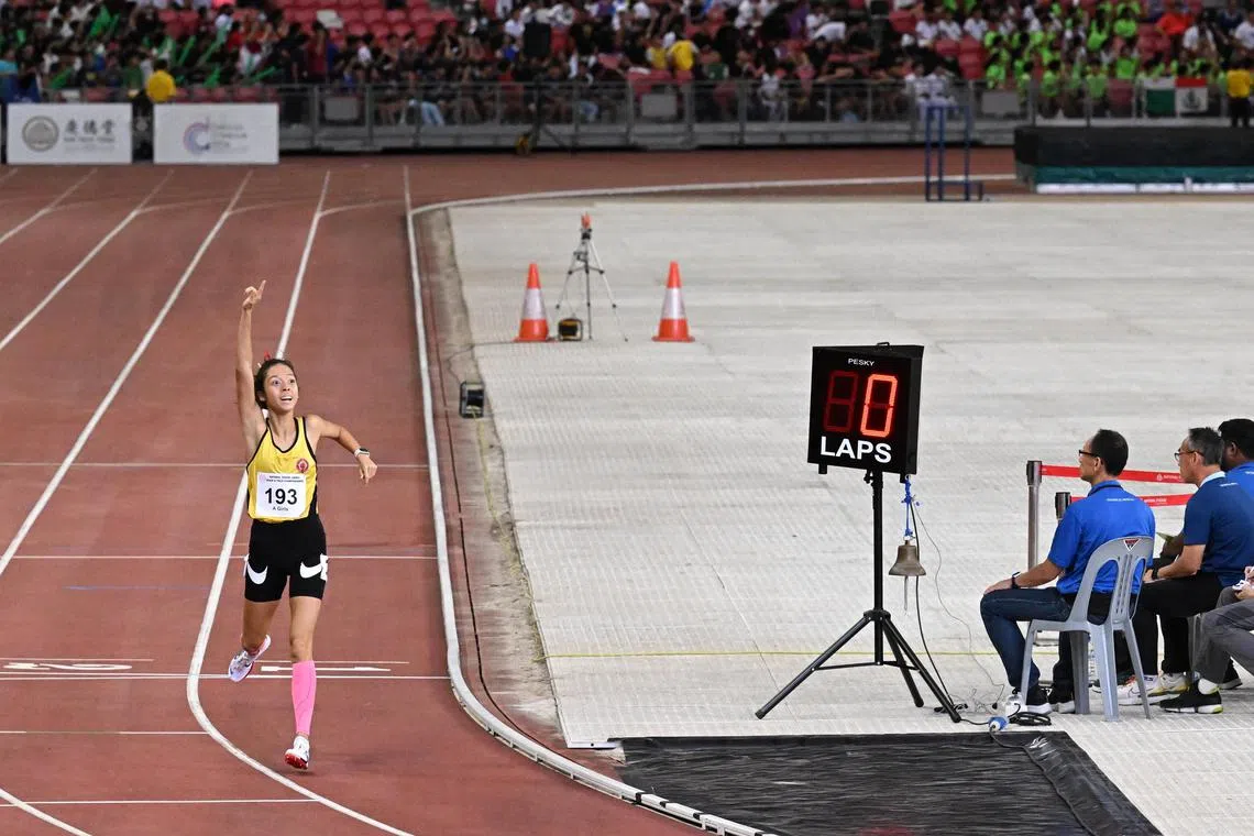Faith Zhen Ford from Victoria Junior College at the A Division 1500m race at the National School Games Track and Field competition. She broke the schools national record in electronic timing for the event after leading from the start.

ST PHOTO: NG SOR LUAN