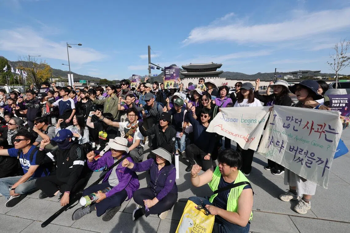 Bereaved families and citizens hold signs and chant slogans demanding a full investigation into the tragedy during a march to mark the fourth anniversary of the Itaewon crowd crush on Oct 17.