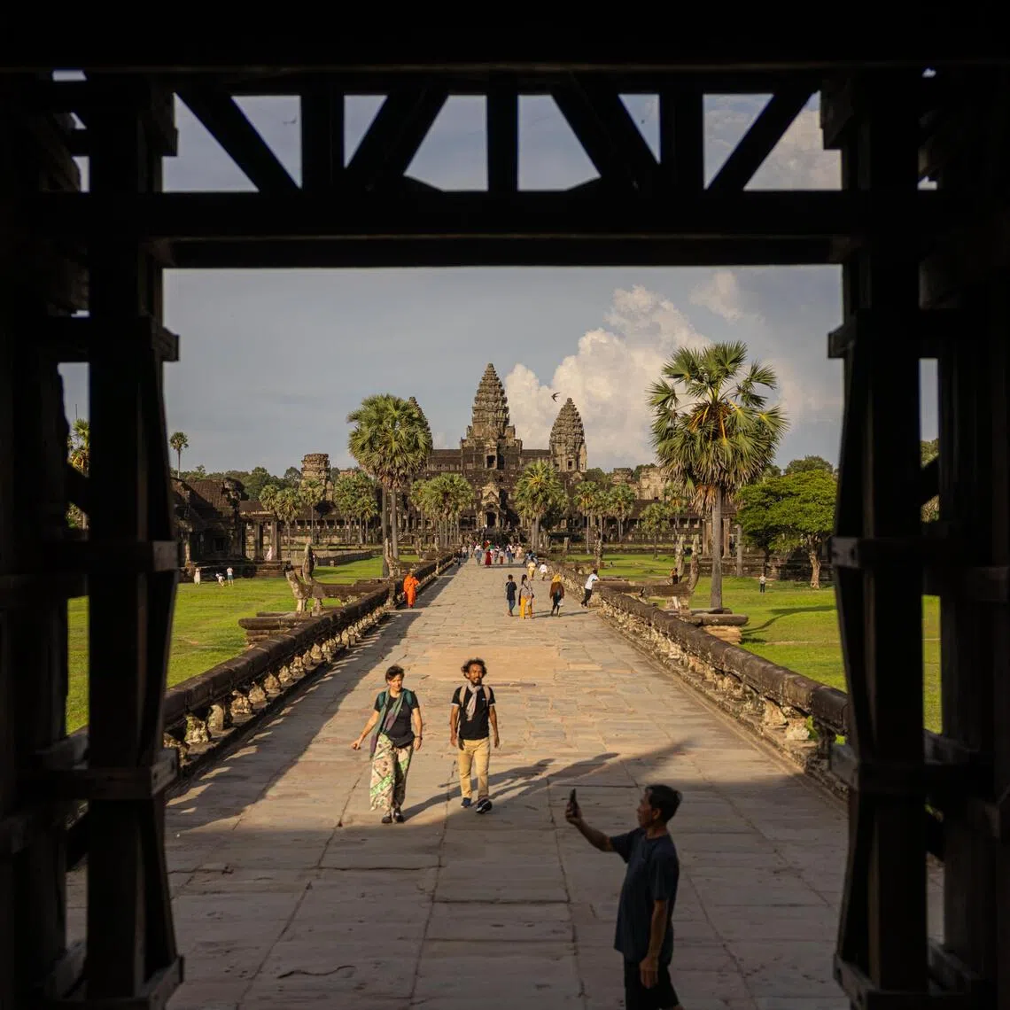 Tourists at the quieter-than-usual Angkor Wat temple complex in Siem Reap, Cambodia, on June 17.