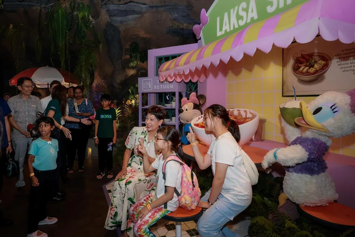 Minister in the Prime Minister’s Office Indranee Rajah with visitors at the Disney Garden of Wonder at Gardens by the Bay on June 20.