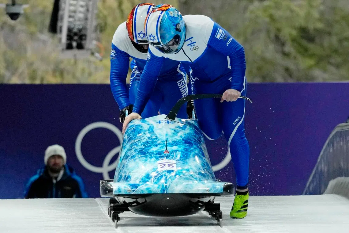 Feb 16, 2026; Cortina d'Ampezzo, Italy; Adam Edelman and Menachem Chen of Israel during two-man bobsleigh during the Milano Cortina 2026 Olympic Winter Games at Cortina Sliding Centre. Mandatory Credit: Michael Madrid-Imagn Images